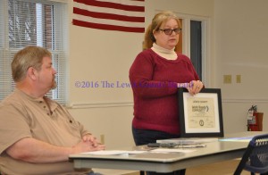 Angie Potter displays the certificate designating Lewis County as a Work Ready Community in Progress as Chamber of Commerce President John Grabill looks on. - Photo by Dennis Brown