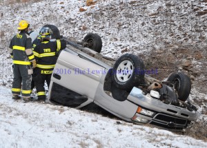 Tollesboro Fire and Rescue personnel on the scene of a single vehicle accident Thursday morning on the AA Highway at Heron Hill. - Photo by Dennis Brown