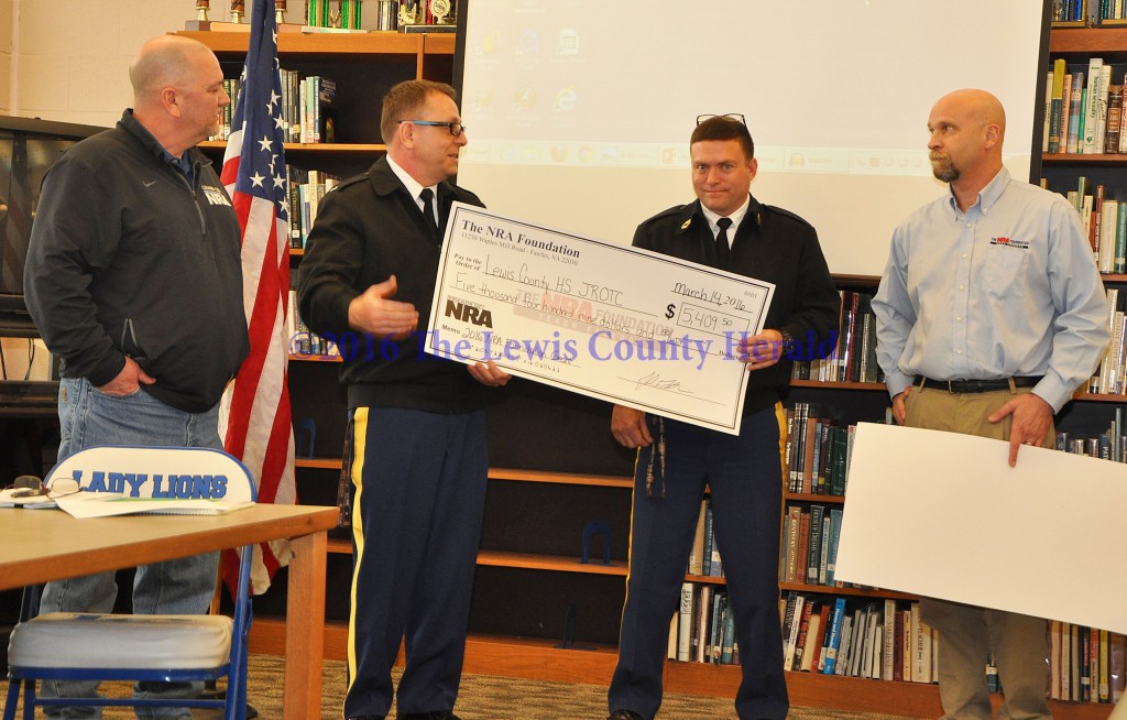 Lewis County Friends of NRA Chairman Kenny Ruckel, Chief Hilger, Sergeant Stone, and Kentucky NRA Field Representative John LaRowe. NRA Grant awarded to LCHS JROTC, $5,409.50. - Photo by Dennis Brown
