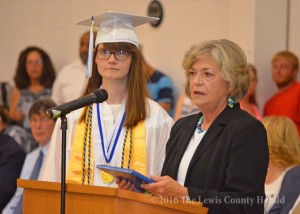 Superintendent Belinda Forman presents Laura Beth Thomas a special award for 14 years of perfect attendance. The recognition came during LCHS commencement exercises Friday evening. - Photo by Dennis Brown