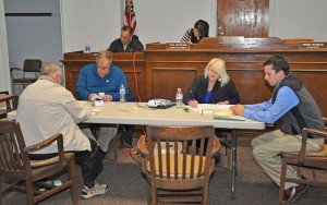 Election officials tally votes in Tuesday's Primary Election. - Photo by Dennis Brown