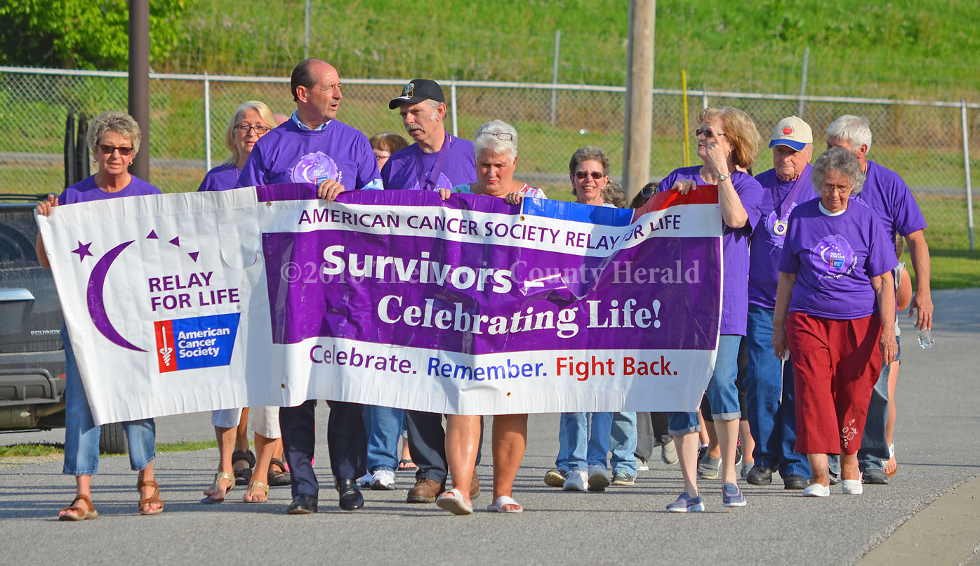 Cancer survivors walk during the Lewis County Relay for Life event on Friday. - Photo by Dennis Brown