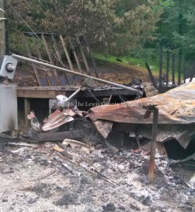 This mobile home was destroyed by fire early Wednesday. Assistance is being sought for the resident.