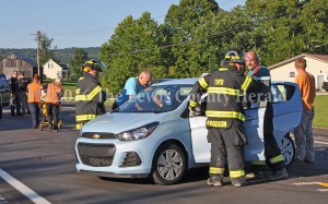 First responders tend to the occupants of an auto involved in an accident Sunday evening on the AA Highway at Charters. - Photo by Dennis Brown