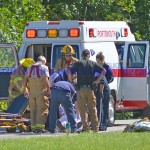 First responders prepare to transfer a Vanceburg teen to a waiting medical helicopter following a four-wheeling accident Saturday afternoon. - Photo by Dennis Brown