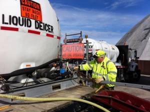 A state road worker prepares a brine mixture that will be applied to roadways in advance of predicted wintry weather.