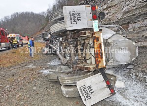 Lewis County Judge Executive Todd Ruckel and Garrison Fire Chief Marty Strong look over the scene of an accident involving a load of bulk lime. No one was hurt in the accident. - Dennis Brown Photo
