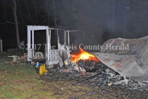 A porch is about all that remains following a mobile home fire on Twin Branch Saturday night. - Dennis Brown Photo