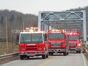 Garrison Fire and Rescue trucks cross the Blue Bridge at Garrison a final time. The bridge closes to all traffic today. It will be replaced by a new bridge. - Karen Killen Photo