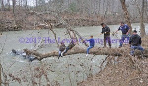 Two men were rescued after their boat nearly capsized in rain swollen Kinniconick Creek. - Dennis Brown Photo