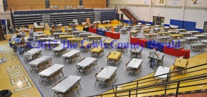 Volunteers set up for the annual Lewis County Friends of NRA Banquet at Lewis County Middle School. - Dennis Brown Photo