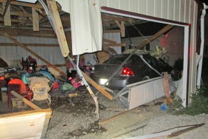 This garage in Garrison sustained extensive damage early Monday when an auto crashed through it.