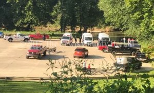 First responders assemble at the Garrison Boat Ramp as efforts are underway to reach three young men who were injured when the four-wheeler they were on plunged off a nearby railroad bridge. - Patricia Grigson Photo 