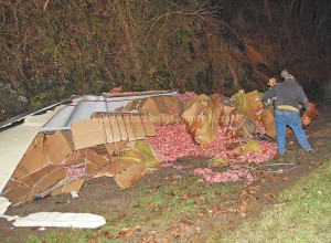 Workers prepare to clean up 43,000 pounds of meat following a tractor-trailer accident Saturday on the AA Highway at Clarksburg. - Dennis Brown Photo