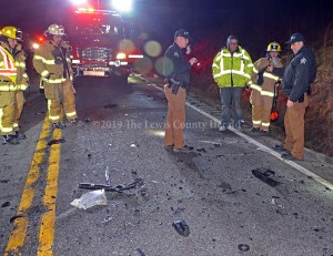 Officials examine the scene of a double fatality early Sunday on KY 8 at Black Oak. The drivers of both vehicles were pronounced dead at the scene. The roadway remained closed for nearly eight hours to allow for the investigation and cleanup of the scene.